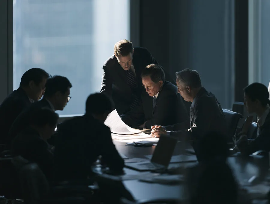 Company directors in a boardroom discussion